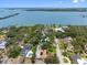 Aerial view of a waterfront community showcasing a home with backyard pool at 8300 37Th N Ave, St Petersburg, FL 33710