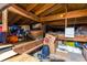 Attic with visible wooden rafters and storage items at 8300 37Th N Ave, St Petersburg, FL 33710