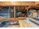 Attic space showing exposed beams and stored items at 8300 37Th N Ave, St Petersburg, FL 33710