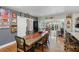 Open dining area with hardwood floors and views of the outdoor area at 8300 37Th N Ave, St Petersburg, FL 33710