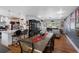 Open dining and kitchen area with stainless steel appliances and hardwood floors at 8300 37Th N Ave, St Petersburg, FL 33710