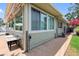 Exterior view of the home showing windows, patio, and access to backyard at 8300 37Th N Ave, St Petersburg, FL 33710