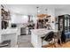 Open kitchen showcasing a center island, stainless steel appliances, and modern decor at 8300 37Th N Ave, St Petersburg, FL 33710