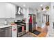Modern kitchen with stainless appliances, granite counters, and hardwood flooring at 8300 37Th N Ave, St Petersburg, FL 33710