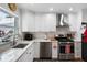 Stylish kitchen with granite counters, modern appliances and bright white cabinets at 8300 37Th N Ave, St Petersburg, FL 33710