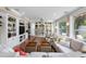 Bright living room featuring built-in shelving and travertine flooring at 8300 37Th N Ave, St Petersburg, FL 33710