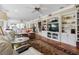 Spacious living room with travertine floors and built-in shelving at 8300 37Th N Ave, St Petersburg, FL 33710