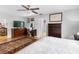 Comfortable main bedroom showing a dresser, television, and hardwood floors at 8300 37Th N Ave, St Petersburg, FL 33710
