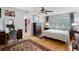 Main bedroom with hardwood floors, shutters, and a vanity area at 8300 37Th N Ave, St Petersburg, FL 33710