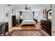 Cozy main bedroom with hardwood floors, shutters, and a ceiling fan at 8300 37Th N Ave, St Petersburg, FL 33710