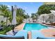 Relax by the sparkling pool on comfortable blue lounge chairs at 8300 37Th N Ave, St Petersburg, FL 33710
