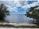 Community waterfront view of the calm water under a blue sky with scattered clouds at 8300 37Th N Ave, St Petersburg, FL 33710