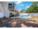 Backyard view features a private pool, patio, and second story deck area for outdoor enjoyment at 921 Lynnlea Ln, Tarpon Springs, FL 34689