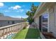 Upper balcony furnished with table, chairs and umbrella at 921 Lynnlea Ln, Tarpon Springs, FL 34689