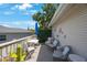 Balcony with table, chairs and umbrella at 921 Lynnlea Ln, Tarpon Springs, FL 34689