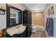 Well-appointed bathroom with warm neutral colors, wooden style floors and modern fixtures for a relaxing experience at 921 Lynnlea Ln, Tarpon Springs, FL 34689