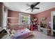 Bright bedroom with playful decor, and natural light, ideal for a growing Gathering at 921 Lynnlea Ln, Tarpon Springs, FL 34689