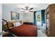 Comfortable bedroom with hardwood floors, and a cozy reading nook, bathed in natural light at 921 Lynnlea Ln, Tarpon Springs, FL 34689