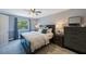 Cozy bedroom with a large window, stylish decor, providing natural light and comfortable space at 921 Lynnlea Ln, Tarpon Springs, FL 34689
