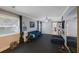 Bright flex room with a comfortable couch, compact bar, and well-lit interior at 921 Lynnlea Ln, Tarpon Springs, FL 34689