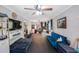View of a flex room with a TV, kitchenette, and diverse seating arrangements at 921 Lynnlea Ln, Tarpon Springs, FL 34689