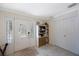 Inviting foyer with decorative glass door, tiled floor, and ample natural light for a welcoming entrance at 921 Lynnlea Ln, Tarpon Springs, FL 34689