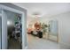 Inviting living room with a modern desk, neutral walls, and an archway leading to other rooms at 921 Lynnlea Ln, Tarpon Springs, FL 34689