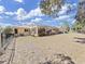 Large backyard features a screened-in patio and black aluminum fencing surrounding the perimeter of the property at 9460 Bearfoot Trl, Weeki Wachee, FL 34613