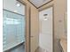 Well-lit bathroom featuring a glass-enclosed shower at 9460 Bearfoot Trl, Weeki Wachee, FL 34613