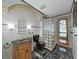 Unique bathroom featuring stylish vanity, toilet and glass block shower at 9460 Bearfoot Trl, Weeki Wachee, FL 34613