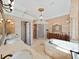 Spacious bathroom with double vanities, a soaking tub, and a glass-enclosed shower at 9460 Bearfoot Trl, Weeki Wachee, FL 34613