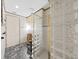 Unique bathroom featuring stylish vanity, toilet and glass block shower at 9460 Bearfoot Trl, Weeki Wachee, FL 34613