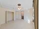 Spacious bedroom with tiled floors, walk-in closet, and ceiling fan at 9460 Bearfoot Trl, Weeki Wachee, FL 34613