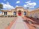 Inviting home with well-maintained landscaping and a brick pathway leading to the entrance at 9460 Bearfoot Trl, Weeki Wachee, FL 34613