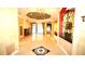 Spacious foyer with tile flooring, chandelier, and intricate architectural details at 9460 Bearfoot Trl, Weeki Wachee, FL 34613