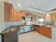 Well-equipped kitchen with stainless steel appliances and ample cabinet space at 9460 Bearfoot Trl, Weeki Wachee, FL 34613