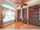 Charming office space with custom built-in bookshelves and a large window at 9460 Bearfoot Trl, Weeki Wachee, FL 34613