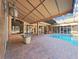 Inviting pool with a brick paved deck and partially covered patio at 9460 Bearfoot Trl, Weeki Wachee, FL 34613
