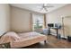 Bedroom with wood floors, ceiling fan, and window with natural light at 9740 Lake Chase Island Way # 9740, Tampa, FL 33626