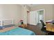 Cozy bedroom with wood floors and access to bathroom and closet at 9740 Lake Chase Island Way # 9740, Tampa, FL 33626