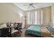 Bedroom featuring wood floors and a window providing natural light at 9740 Lake Chase Island Way # 9740, Tampa, FL 33626