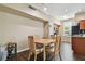 Cozy dining area with a wooden table and chairs, next to an open kitchen at 9740 Lake Chase Island Way # 9740, Tampa, FL 33626