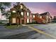 A charming stucco home with shuttered windows and a front door in a pleasant residential neighborhood at 9740 Lake Chase Island Way # 9740, Tampa, FL 33626