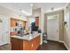 Bright kitchen with granite counters, black appliances and breakfast bar at 9740 Lake Chase Island Way # 9740, Tampa, FL 33626