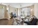 Bright living room with hardwood floors, large windows, contemporary decor, and a comfortable seating area at 9740 Lake Chase Island Way # 9740, Tampa, FL 33626