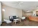Stylish living room with hardwood floors, contemporary decor, and an open layout leading to the kitchen at 9740 Lake Chase Island Way # 9740, Tampa, FL 33626