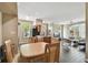 Open-concept living space featuring a dining area, kitchen, and living room with hardwood floors at 9740 Lake Chase Island Way # 9740, Tampa, FL 33626
