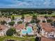 Aerial view showcases community pool, well-maintained landscaping, and convenient parking in a well-planned neighborhood at 10442 Villa View Cir, Tampa, FL 33647