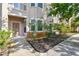 Close-up of a condo entrance with manicured landscaping and a well-lit pathway at 10442 Villa View Cir, Tampa, FL 33647