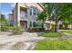 Exterior view of a condo building, showcasing the landscaped surroundings and architectural details at 10442 Villa View Cir, Tampa, FL 33647